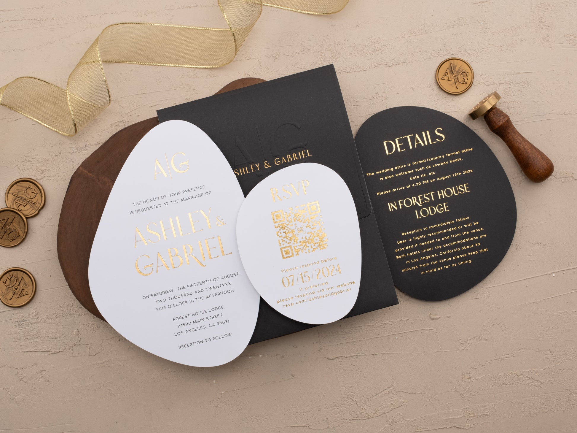 Black wedding invitation envelope with gold foil oval card and matching elements