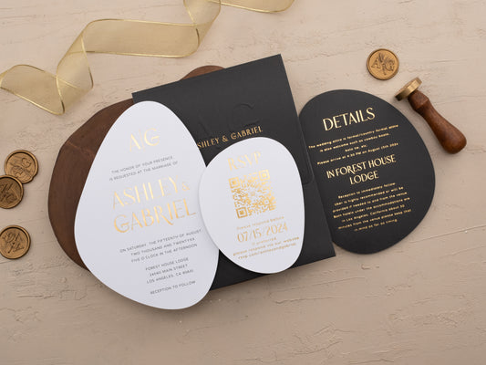 Black wedding invitation envelope with gold foil oval card and matching elements