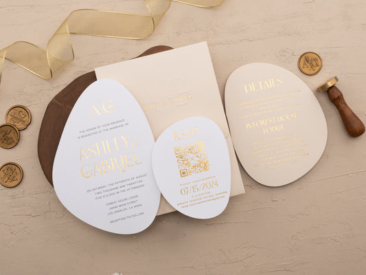 Layered view of invitation card, RSVP, and details card in ivory and gold