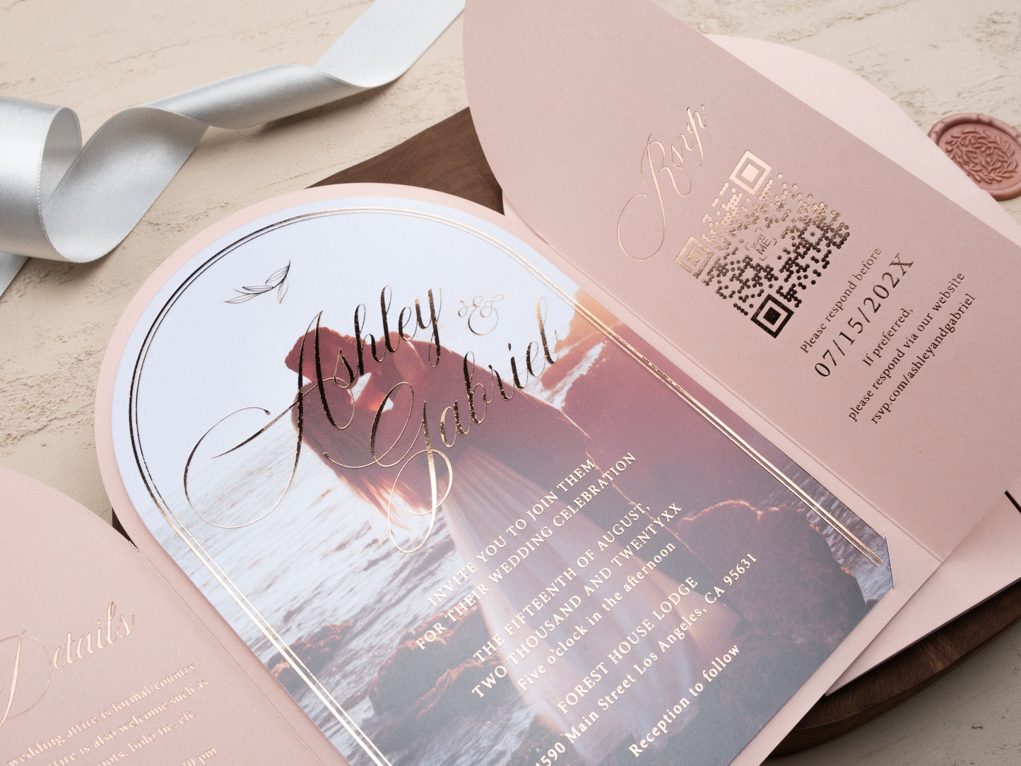 Blush pink arch folded acrylic wedding invitation with rose gold foil and matching RSVP card, styled with Couple Photo Closer Photo
