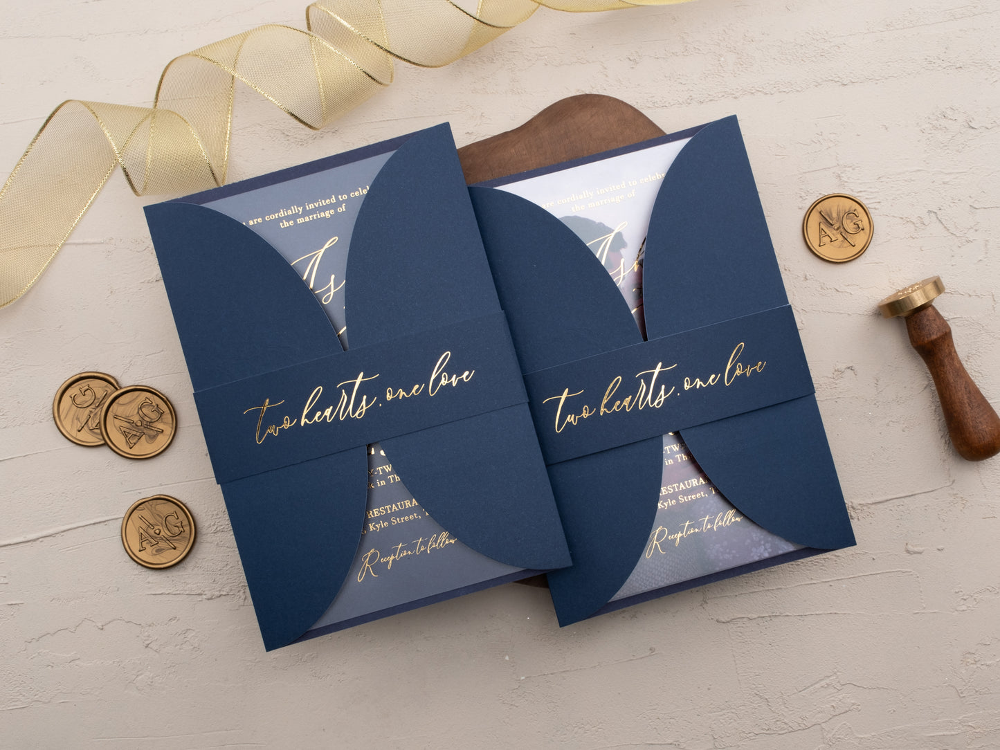 Closed navy curved invitation with belly band and foil details