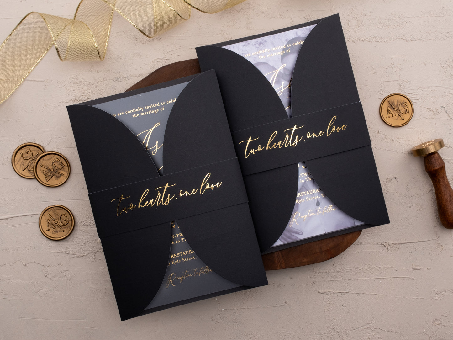 Modern acrylic wedding invitation in matte black with gold calligraphy details