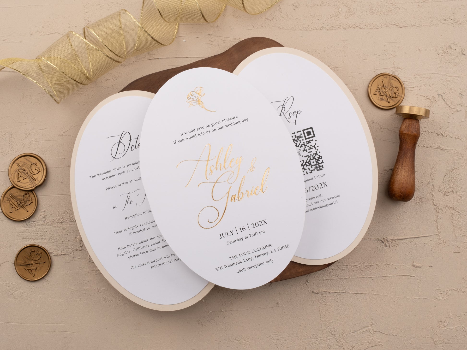 Embossed floral wedding invitation jacket tied with white ribbon, flat lay