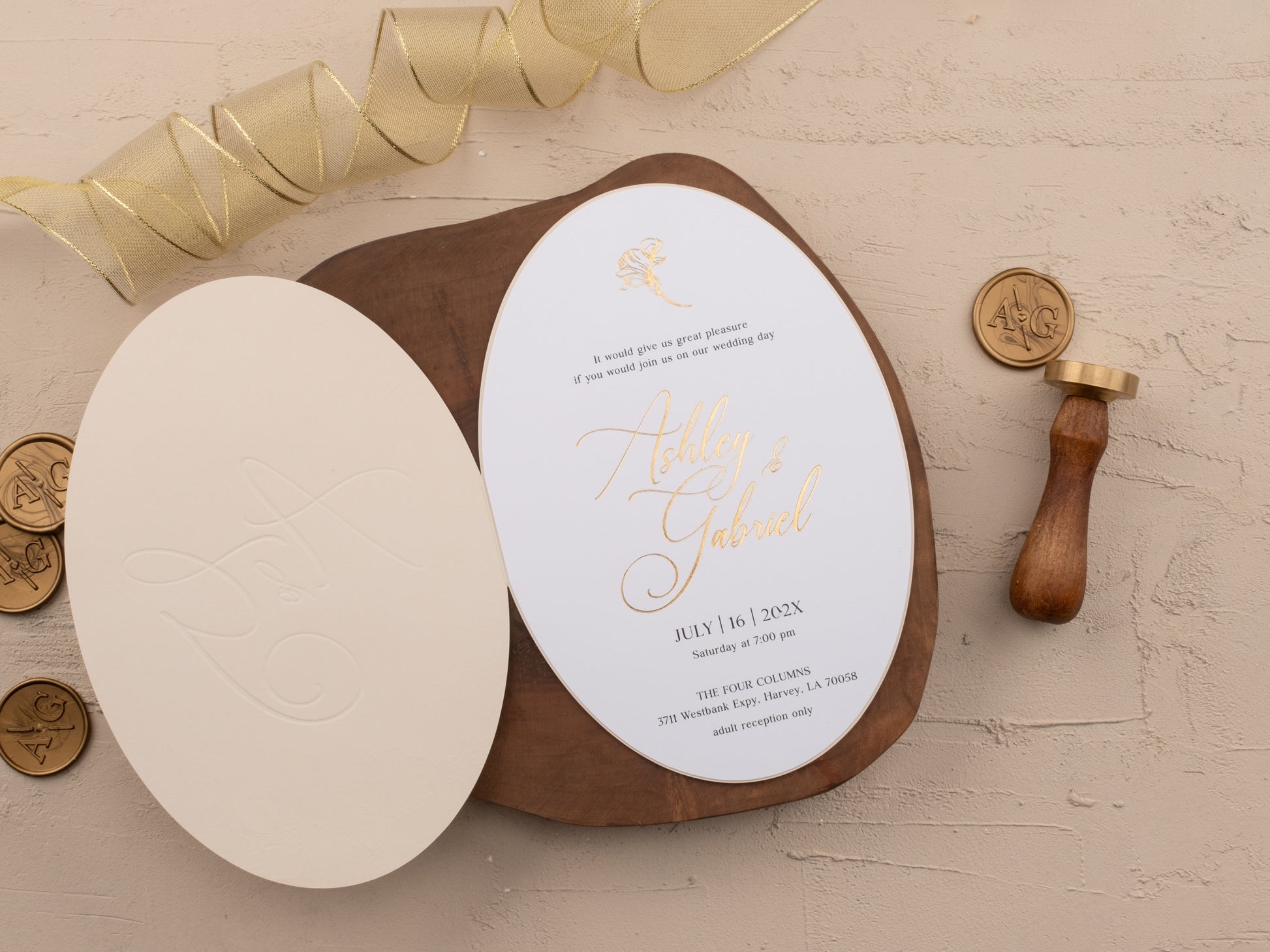 Complete ivory and gold wedding invitation suite with monogram wax seal and ribbon
