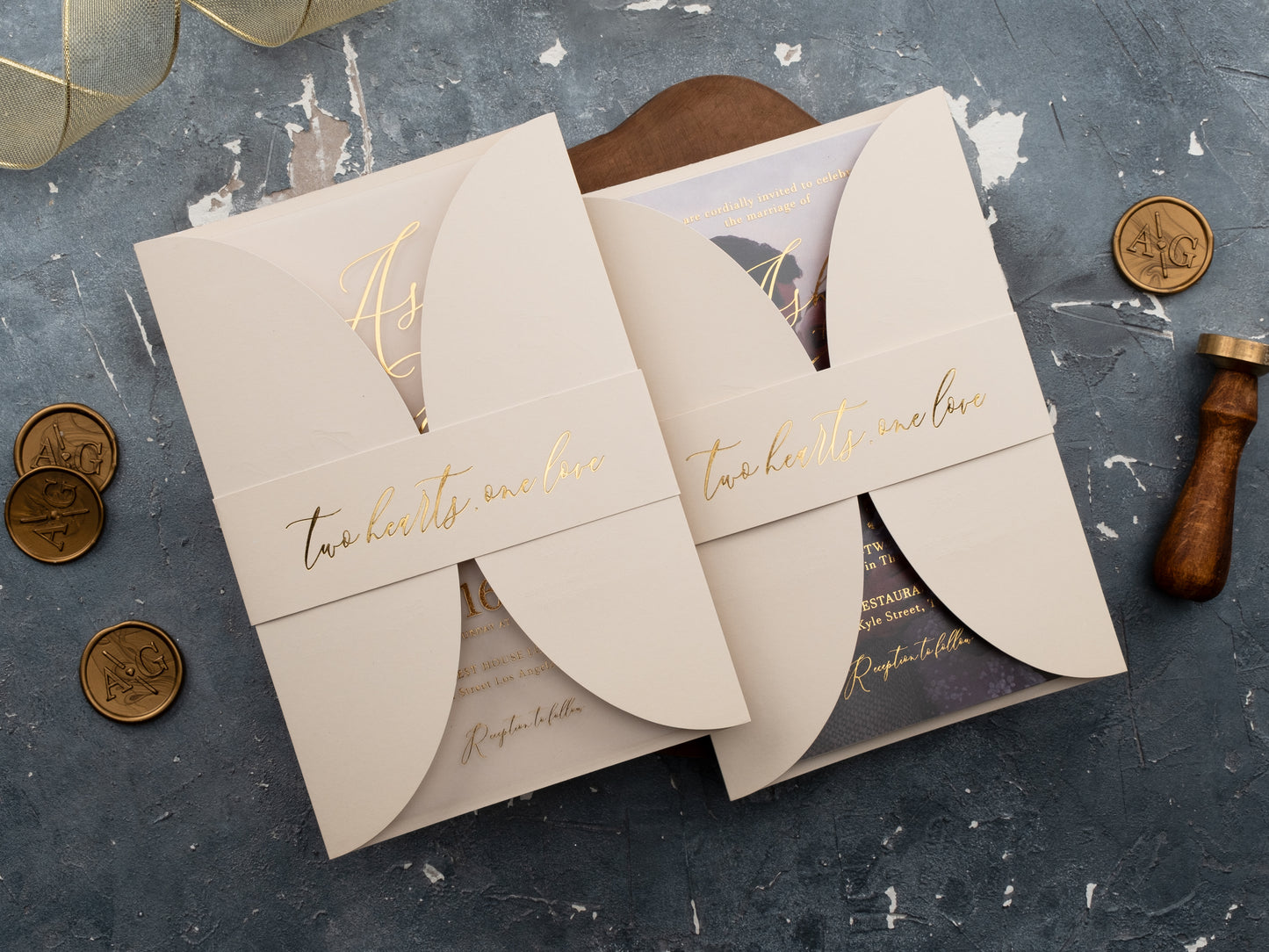 Neutral toned wedding invitation with gold foil and belly band