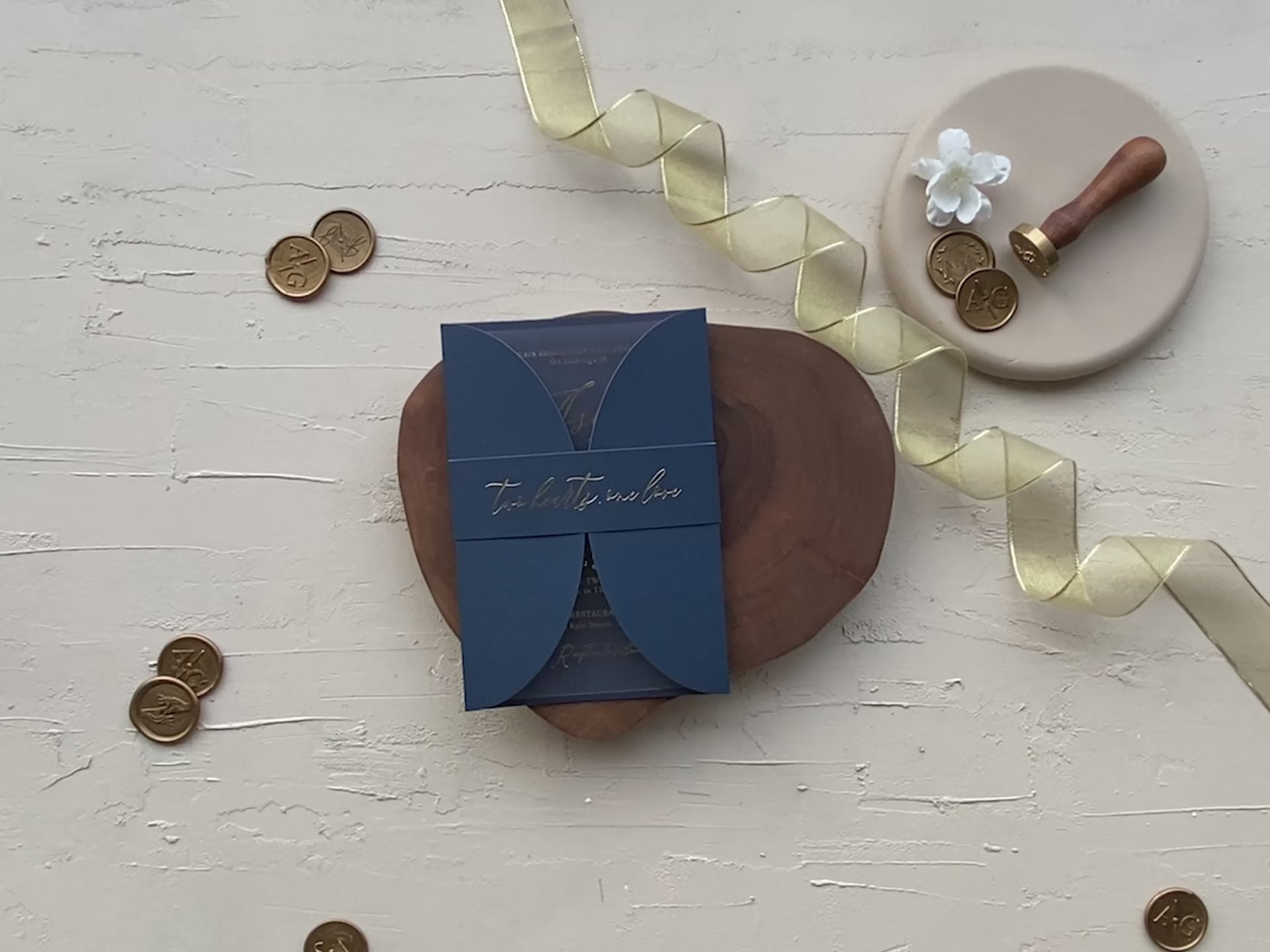 Luxury navy blue acrylic wedding invitation with curved gatefold jacket, gold foil print, RSVP QR code, and photo-ready design.