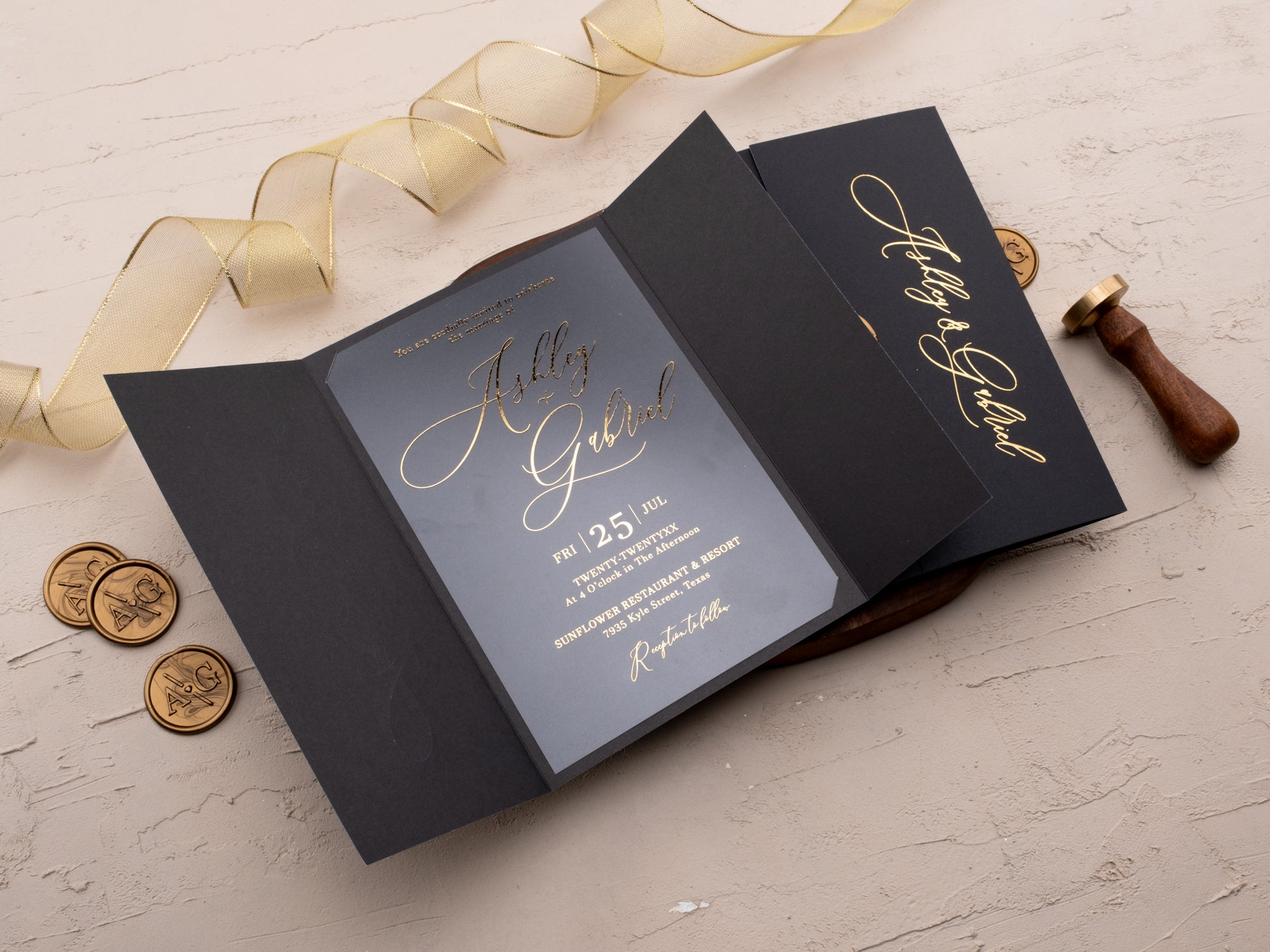 Closed black wedding invitation with gold foil names and custom wax seal