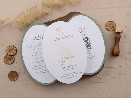 Oval wedding invitation with sage green floral cover and gold foil text