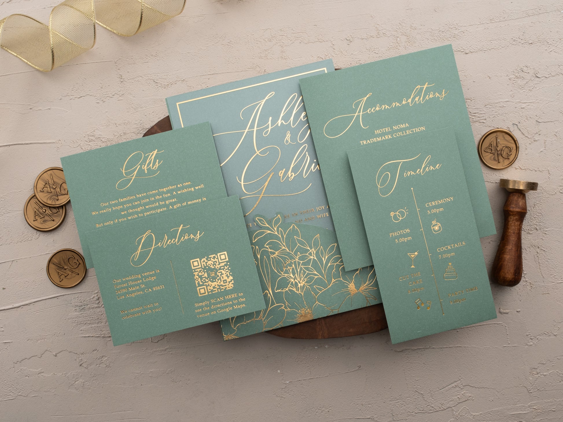 Acrylic wedding invitation with gold foil floral design and matching sage envelope sleeve and Timeline cards